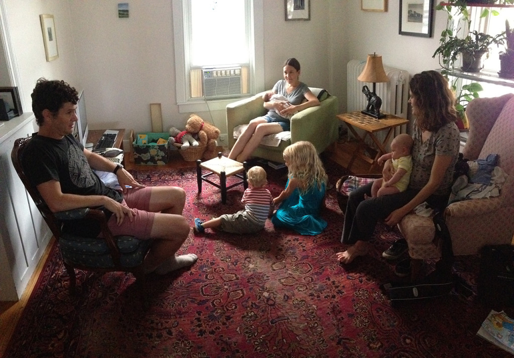 Eight human beings in a room.